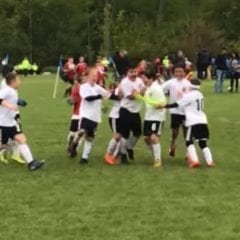 EMSSC Spartans celebrating the shootout win that sent them into the top 10 in Illinois.