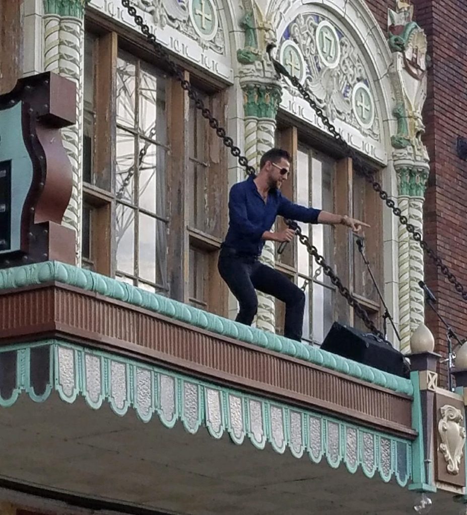 A performer atop the Circa marquee at 1828 3rd Ave., Rock Island.