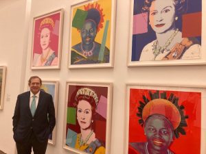 Jordan Schnitzer at the Figge Art Museum with 1985 Andy Warhol prints, "Reigning Queens."