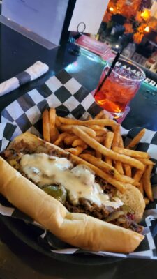 Doc Enjoys The Philly Steak And Cheese From Grease Monkeys Sports Bar And Grill