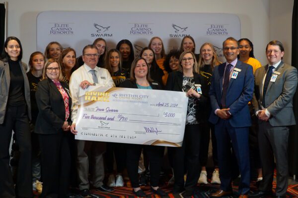 Rhythm City Casino proudly presents Iowa SWARM a $5,000 check!