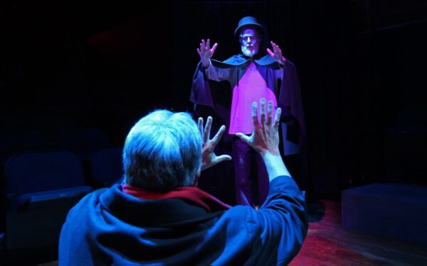 The spirit of Ebeneezer Scrooge (Glenn Kluge) haunts the great detective, Sherlock Holmes (Tom Akers) in "A Sherlock Carol" at Richmond Hill Players, Geneseo.