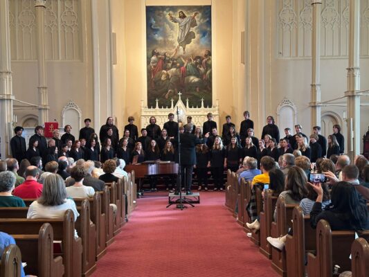 The Augustana Choir performing a fall 2025 concert at First Lutheran Church in Moline.