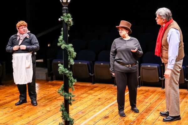Samuel Carrington, left, as Mrs. Dilber, Amanda Wilson as Inspector Lestrade and Tom Akers as Holmes in "A Sherlock Carol."